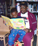 volunteer reads to child