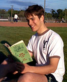 student reading book