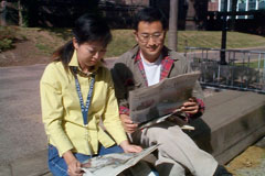 couple reading newspaper