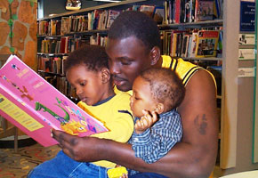 Father reads to his kids